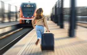 Woman late from train. Tourist running and chasing the leaving t
